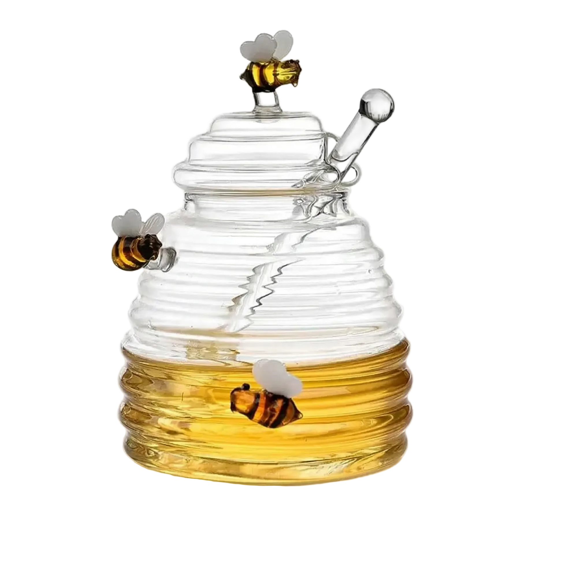 Elegant honungsburk i klarglas formad som en bikupa med horisontella räfflor, matchande lock, integrerad honungssked i glas och dekorativa glasbin, presenterad på en vit bakgrund